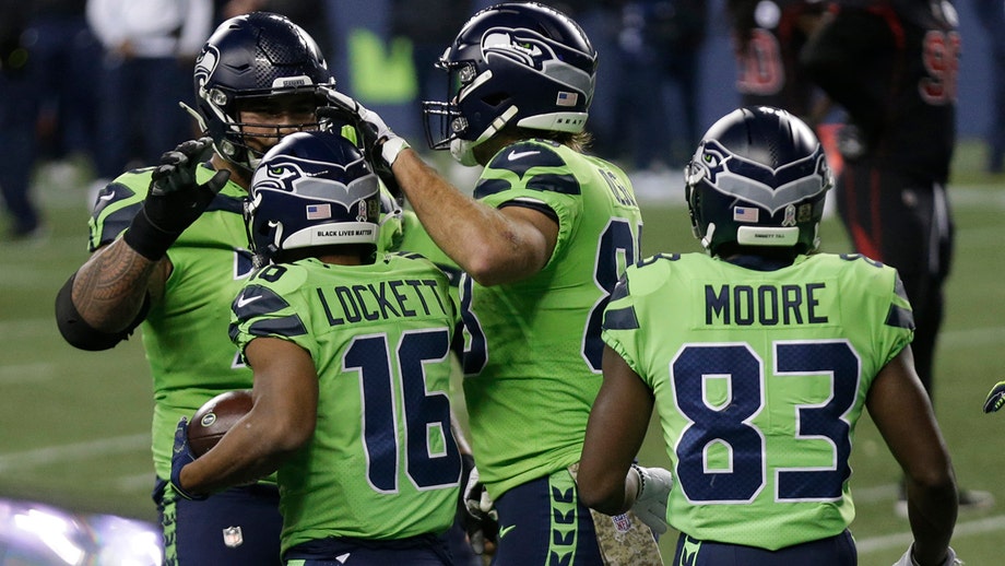 Seahawks take lead in wild NFC West with narrow victory