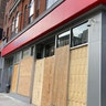 The Bank of America branch on New York City's Court Street, is one of the businesses targeted in clashes last week. It is now fully boarded up.