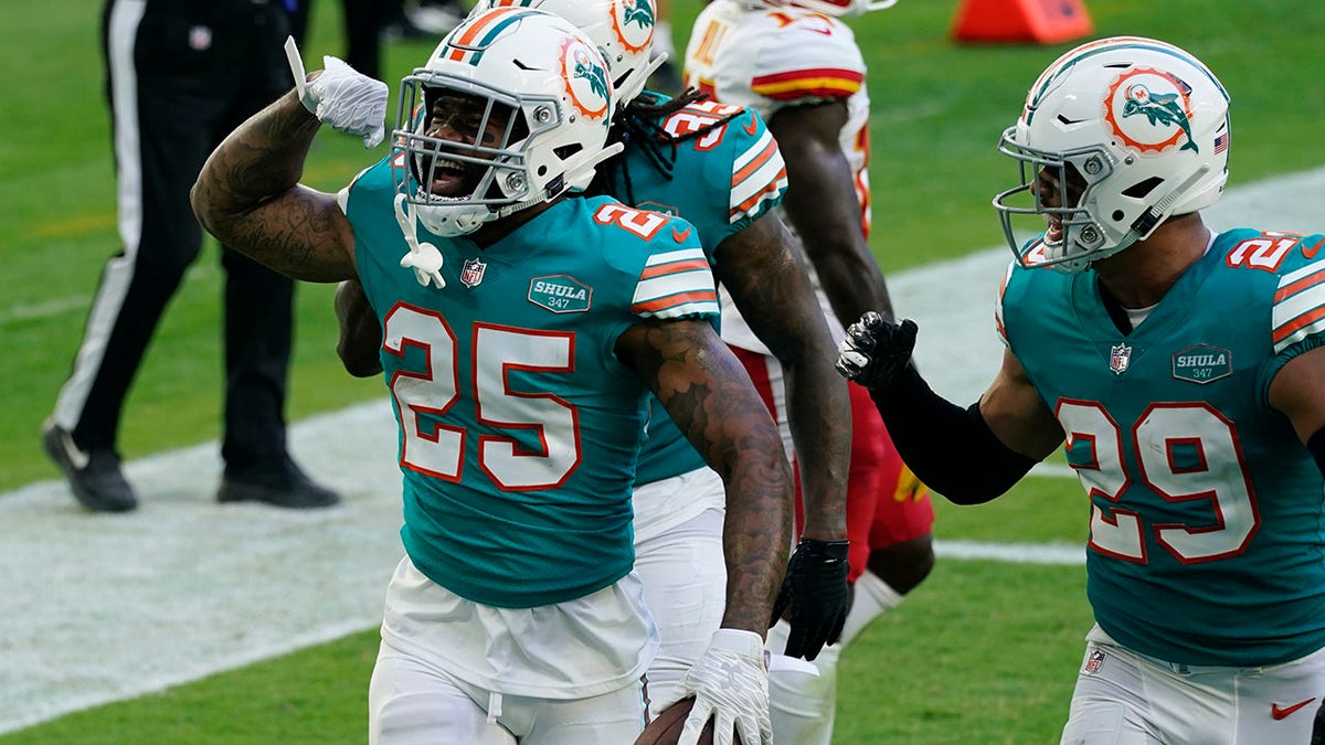 Miami Dolphins cornerback Xavien Howard (25) celebrates after intercepting a pass during the second half of an NFL football game against the Kansas City Chiefs, Sunday, Dec. 13, 2020, in Miami Gardens, Fla. (AP Photo/Lynne Sladky)