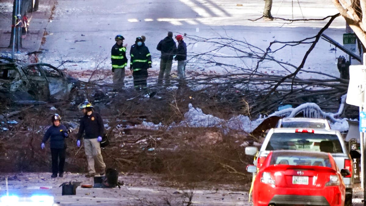 Investigators work at the scene of an explosion Saturday, Dec. 26, 2020, in Nashville, Tenn. 