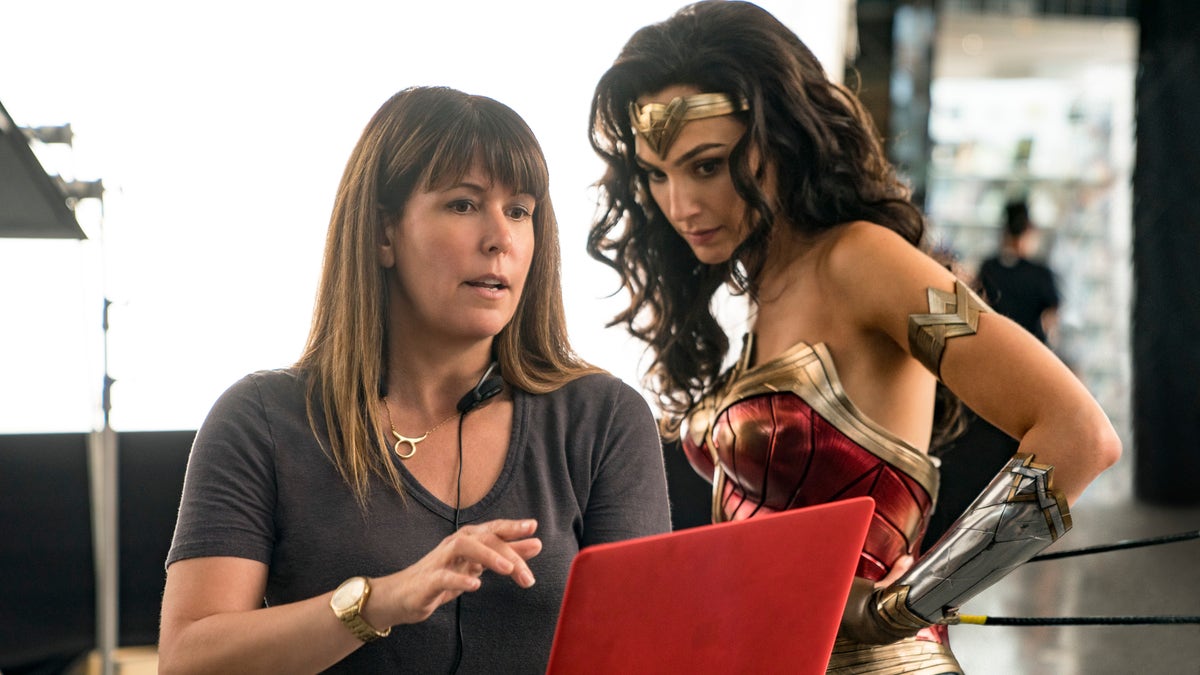 This image released by Warner Bros. Entertainment shows director Patty Jenkins (L) with actress Gal Gadot on the set of 'Wonder Woman 1984.' The movie debuts on HBO Max and in U.S. theaters on Christmas Day. 