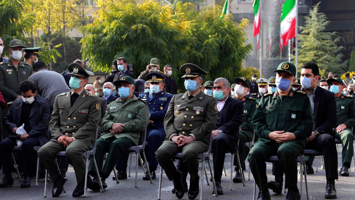 Military commanders attend a funeral ceremony of Mohsen Fakhrizadeh, a scientist who was killed on Friday, in a funeral ceremony in Tehran, Iran, Monday, Nov. 30, 2020. Iran held the funeral Monday for the slain scientist who founded its military nuclear program two decades ago, with the Islamic Republic's defense minister vowing to continue the man's work "with more speed and more power." (Iranian Defense Ministry via AP)