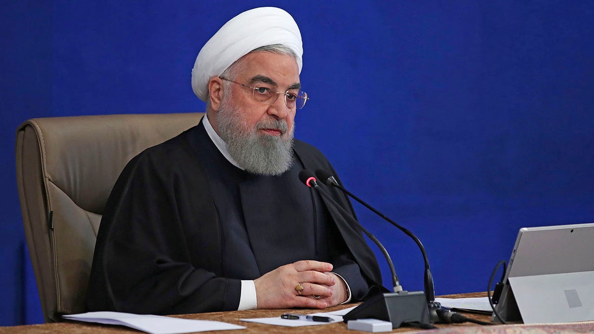 President Hassan Rouhani speaks in a cabinet meeting in Tehran, Iran, Wednesday, Dec. 2, 2020. Rouhani on Wednesday rejected a bill approved by parliament that would have suspended U.N. inspections and boosted uranium enrichment, saying it was "harmful" to diplomatic efforts aimed at restoring the 2015 nuclear deal and easing U.S. sanctions. (Iranian Presidency Office via AP)