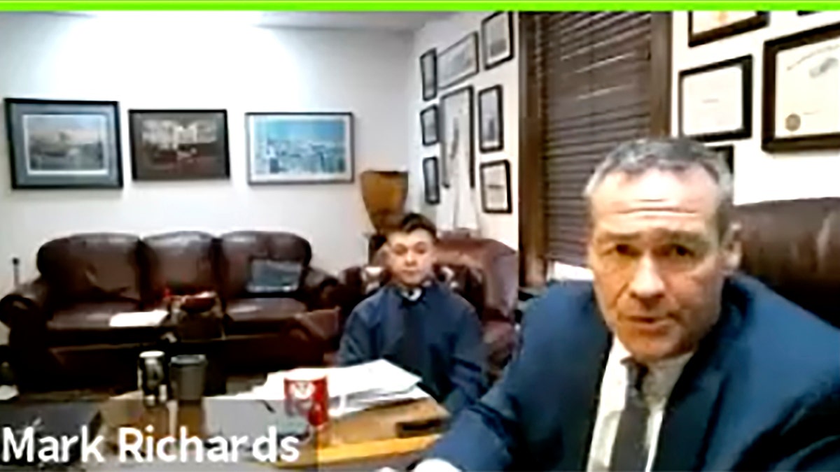 In this screen grab from live stream video, Kyle Rittenhouse, left, appears with his attorney, Mark Richards during a hearing at Kenosha County Court in Kenosha, Wis., on Dec. 3, 2020. A court commissioner has ruled that there is sufficient evidence to warrant a trial for the Illinois teenager accused of killing two men during an August protest in Wisconsin. (Kenosha County Court/ AP)