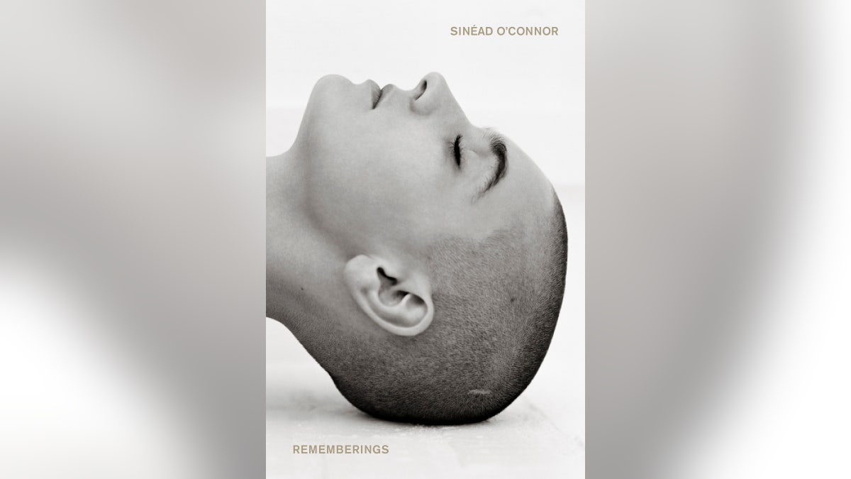 This cover image released by Houghton Mifflin Harcourt shows ‘Rememberings,’ a memoir by Sinead O'Connor, available on June 1. 