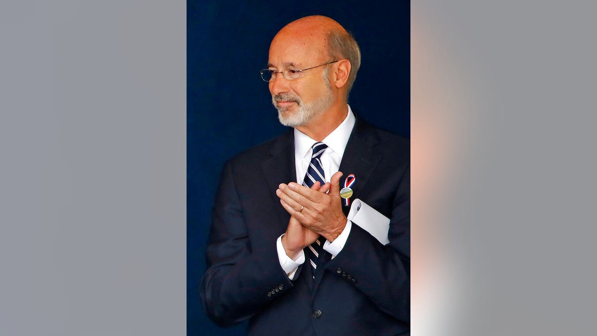 FILE - In this Sept 11, 2018, file photo, Pennsylvania Gov. Tom Wolf attends the September 11th Flight 93 Memorial Service in Shanksville, Pa. Gov. Wolf said Wednesday, Dec. 9, 2020, that he has tested positive for COVID-19 and was isolating at home. (AP Photo/Gene J. Puskar, File)