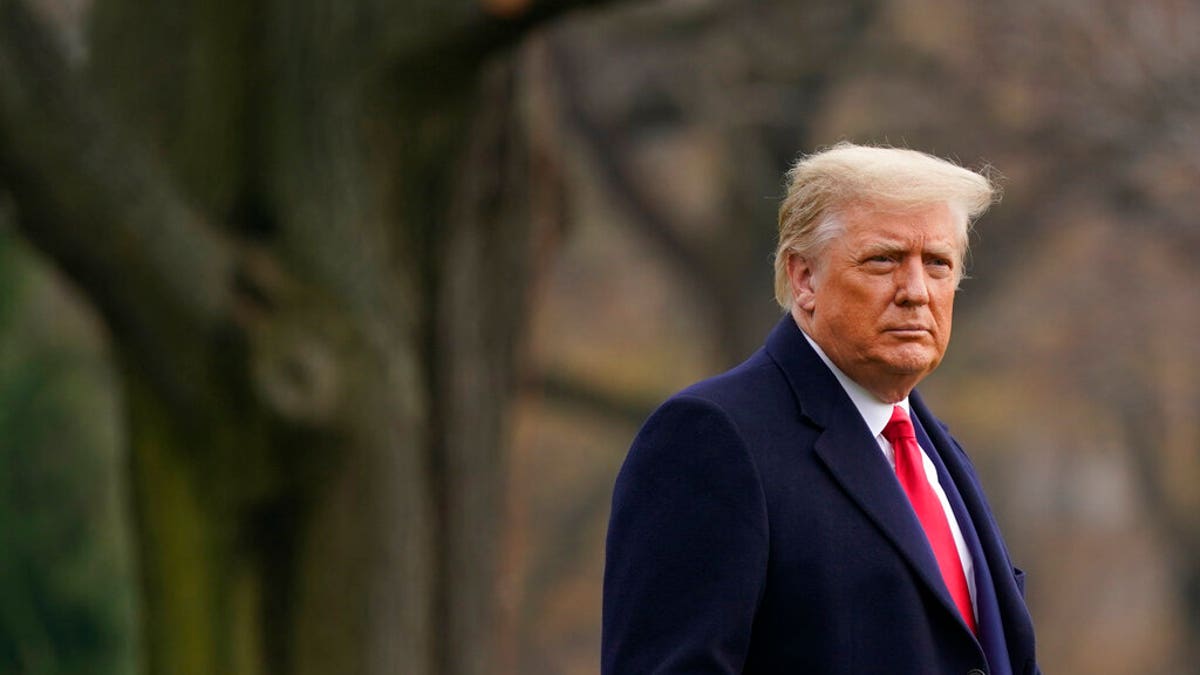 President Donald Trump walks on the South Lawn of the White House in Washington, Dec. 12, before boarding Marine One. Trump went to the Army-Navy Game at the U.S. Military Academy in West Point, N.Y. (AP Photo/Patrick Semansky)