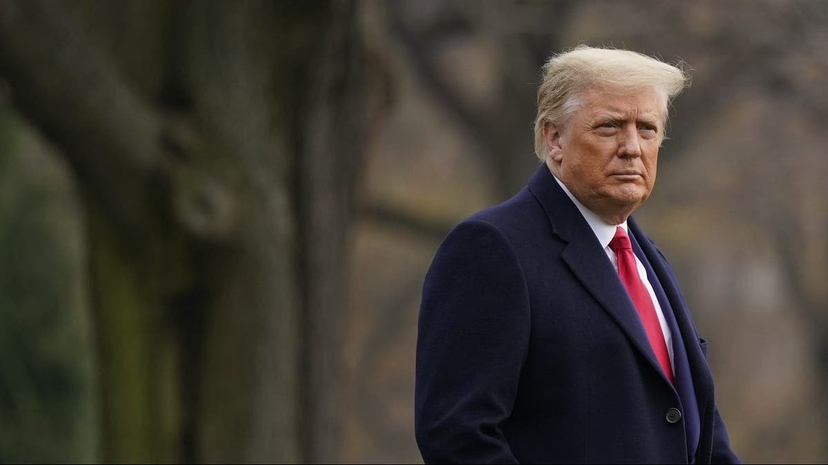 In this Dec. 12, 2020, file photo, President Donald Trump walks on the South Lawn of the White House in Washington before boarding Marine One. 