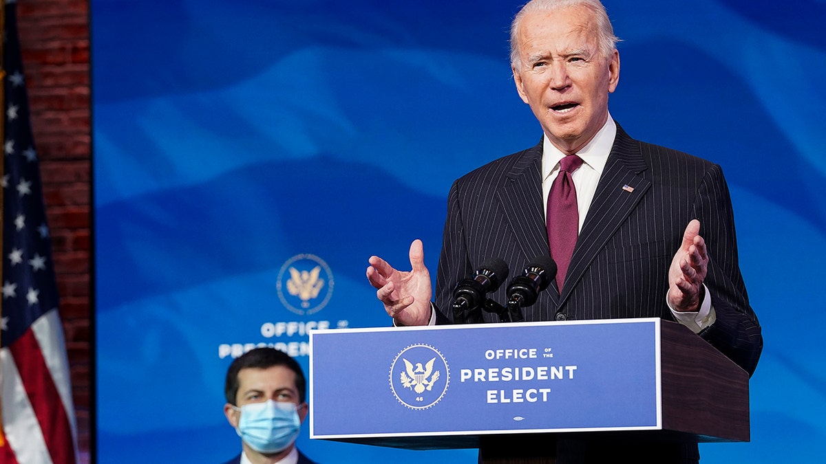 President-elect Joe Biden speaks as he announces former South Bend, Ind. Mayor Pete Buttigieg as his nominee for transportation secretary during a news conference at The Queen theater in Wilmington, Del., Wednesday, Dec. 16, 2020. (Kevin Lamarque/Pool via AP)