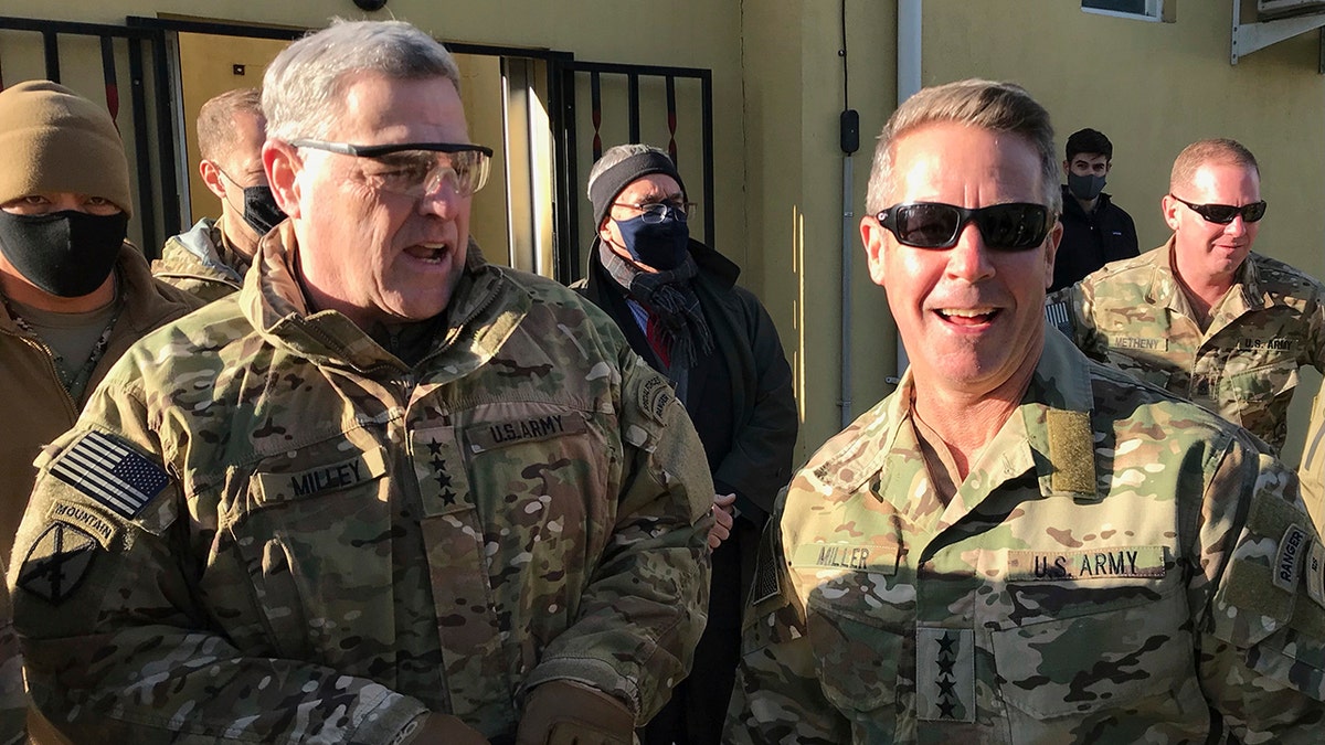 Chairman of the U.S. Joint Chiefs of Staff Gen. Mark Milley, left, talks with Gen. Scott Miller, the commander of U.S. and coalition forces in Afghanistan, Wednesday, Dec. 16, 2020, at Miller’s military headquarters in Kabul, Afghanistan. The top U.S. military officer has held an unannounced meeting with Taliban peace negotiators to push for a reduction in violence in Afghanistan. (AP Photo/Robert Burns)