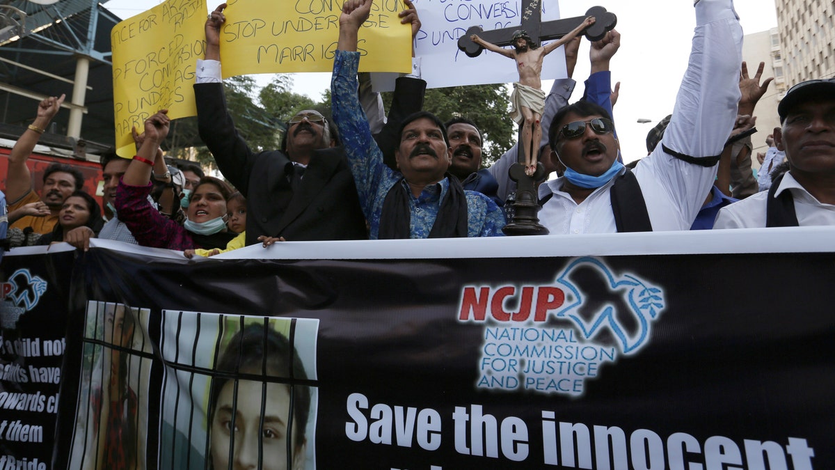 Pakistani Christians protest against child marriage and forced conversion to Islam in Karachi, Pakistan, Nov. 8, 2020. Rights groups say each year in Pakistan, as many as 1,000 girls are forcibly converted, often after being abducted or tricked. (AP Photo/Fareed Khan)