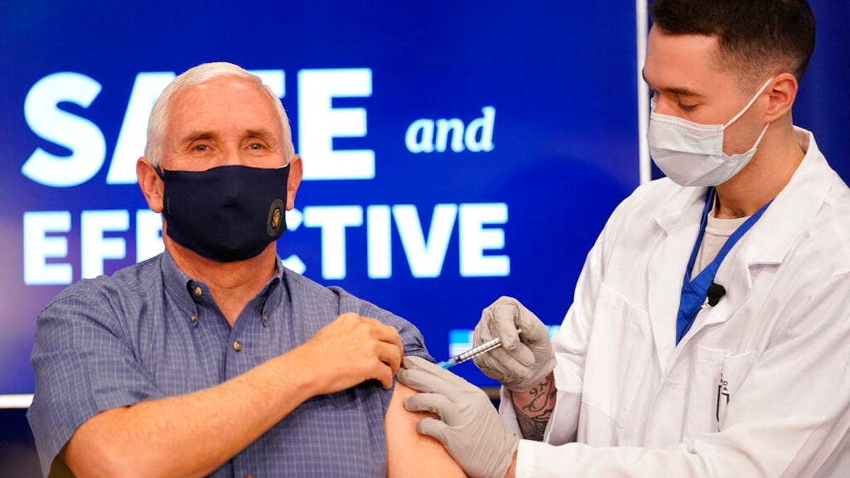 Vice President Mike Pence receives a Pfizer-BioNTech COVID-19 vaccine shot at the Eisenhower Executive Office Building on the White House complex, Friday, Dec. 18, 2020, in Washington. Karen Pence, and U.S. Surgeon General Jerome Adams also participated. (AP Photo/Andrew Harnik)