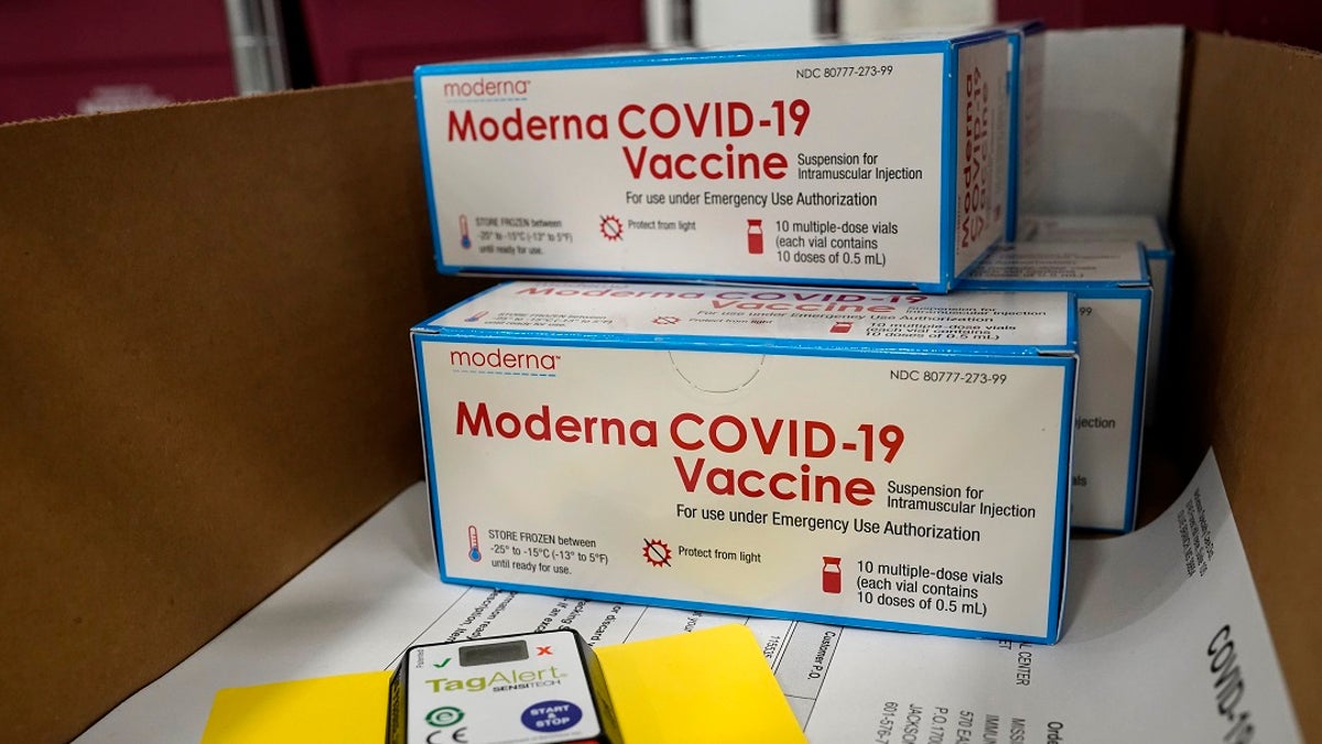 Boxes containing the Moderna COVID-19 vaccine are prepared to be shipped at the McKesson distribution center in Olive Branch, Miss., Dec. 20. (AP Photo/Paul Sancya, Pool)