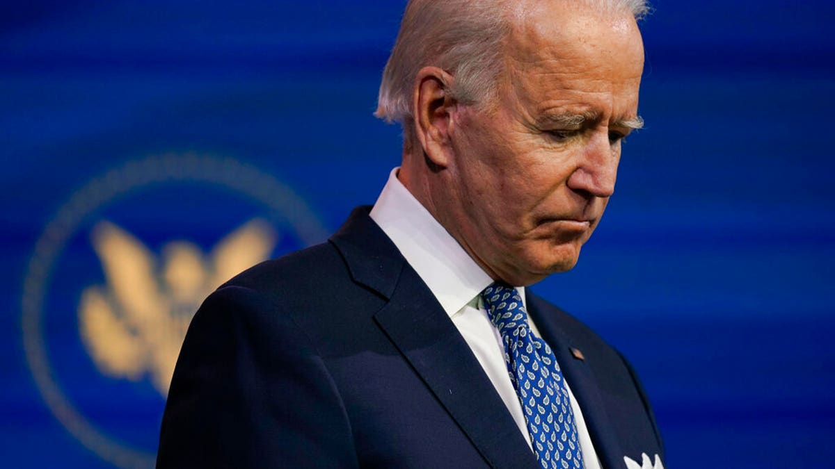 President-elect Joe Biden pauses as he speaks at The Queen Theater in Wilmington, Del., Tuesday, Dec 22, 2020. (AP Photo/Carolyn Kaster)