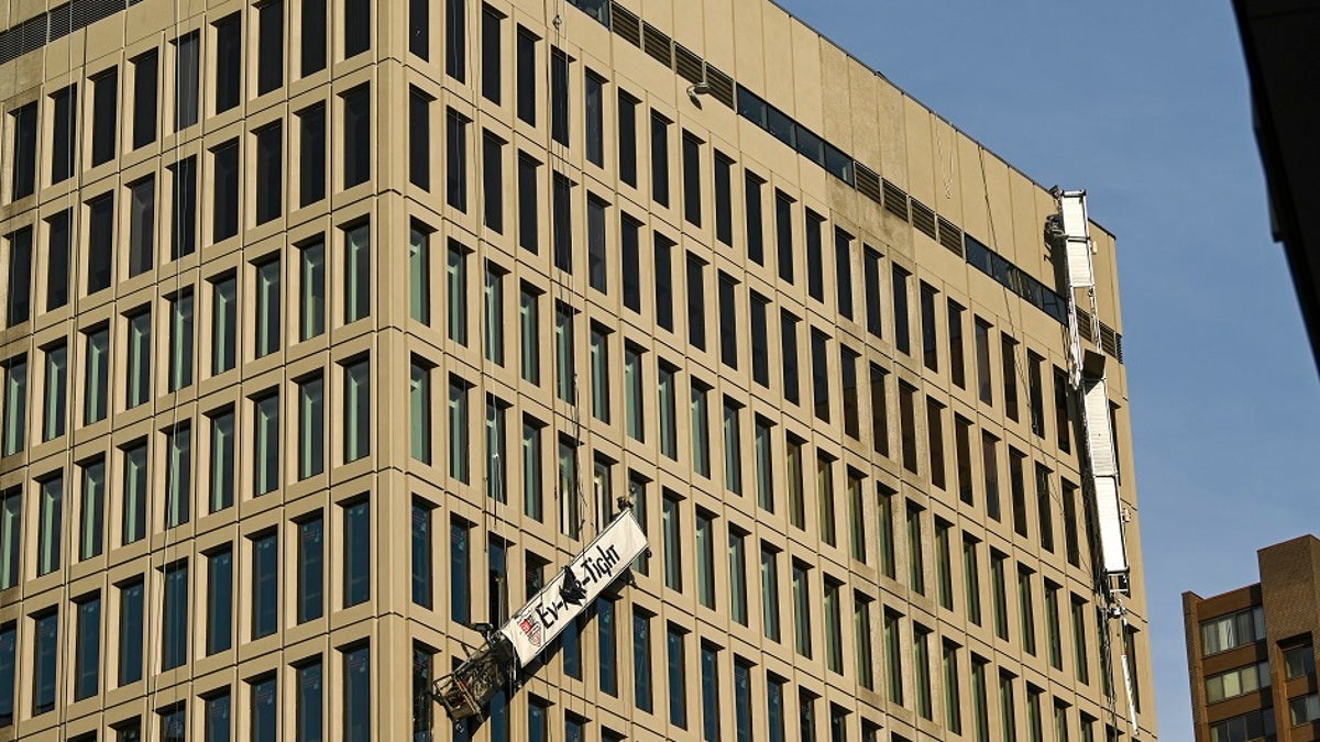 Damaged scaffolding hangs off the side of the Baltimore Gas and Electric building on Wednesday in Baltimore. Twenty-one of the victims were brought to area hospitals following the explosion with a partial roof collapse. The city’s fire department tweeted that at least nine of the victims were in critical condition, while another was in serious condition. (Jerry Jackson/The Baltimore Sun via AP)