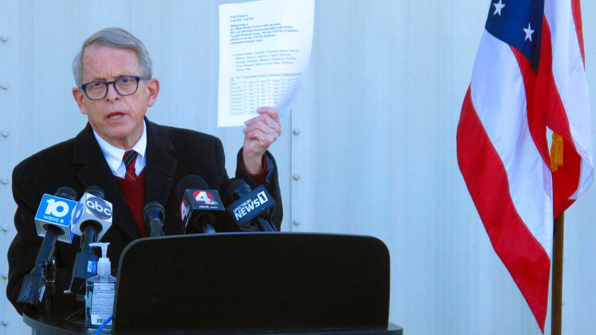 FILE - In this Nov. 18, 2020 file photo, Republican Ohio Gov. Mike DeWine discusses the most recent data on Ohio's soaring coronavirus cases during a news briefing at John Glenn International Airport on in Columbus, Ohio. State lawmakers across the country will be convening in 2021 with the continuing COVID-19 pandemic rippling through much of their work — and even affecting the way they work. After 10 months of emergency orders and restrictions from governors and local executive officials, some state lawmakers are eager to reassert their power over statewide decisions shaping the way people shop, work, worship and attend school. (AP Photo/Andrew Welsh-Huggins, File)