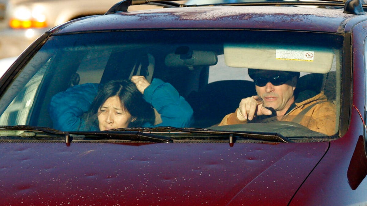 FILE - In this Jan. 11, 2010, file photo, Richard Heene, right, and his wife, Mayumi, arrive at the Laramie County Detention Center in Fort Collins, Colo. (AP Photo/ Ed Andrieski, File)