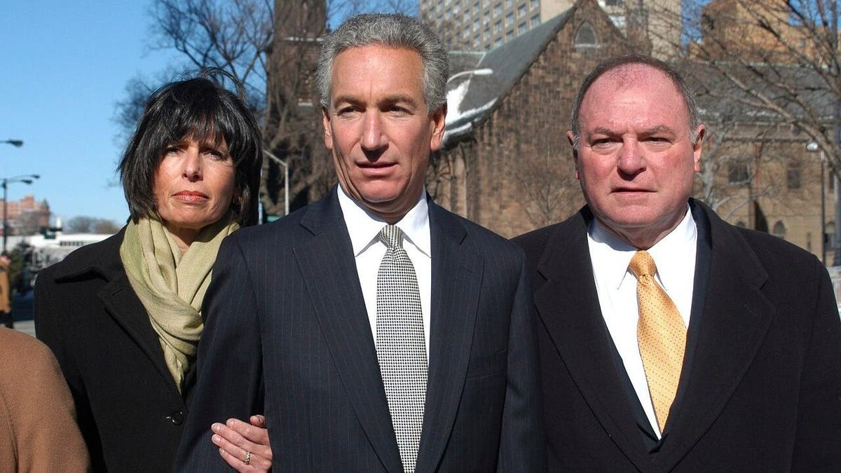 In this March 4, 2005 file photo, Charles B. Kushner, flanked by his wife, Seryl Beth, left, and his attorney Alfred DeCotiis arrives at the Newark Federal Court for sentencing in Newark, N.J. (AP Photo/Marko Georgiev)