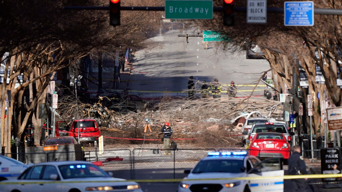 Investigators continue to examine the site of an explosion Sunday, Dec. 27, 2020, in downtown Nashville, Tenn. (AP Photo/Mark Humphrey)