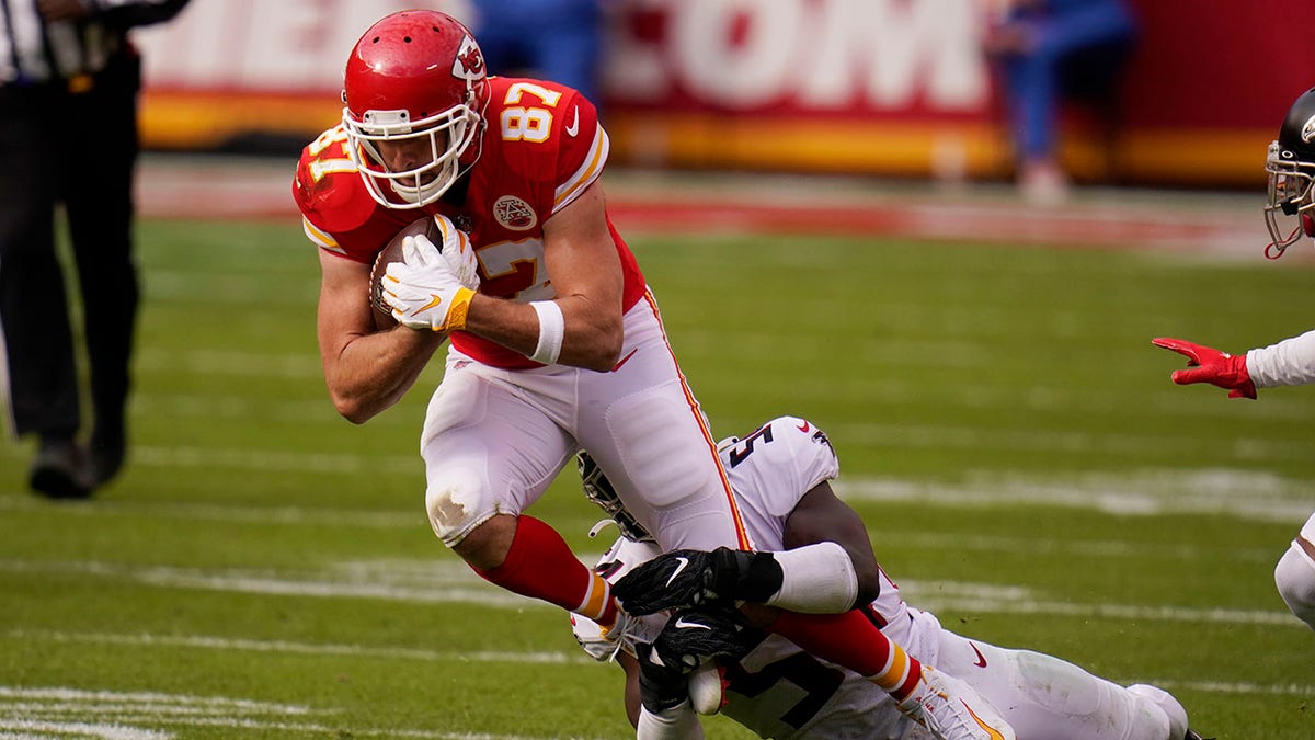 Kansas City Chiefs tight end Travis Kelce is tackled by Atlanta Falcons Foyesade Oluokun during the first half of an NFL football game, Sunday, Dec. 27, 2020, in Kansas City. (AP Photo/Jeff Roberson)