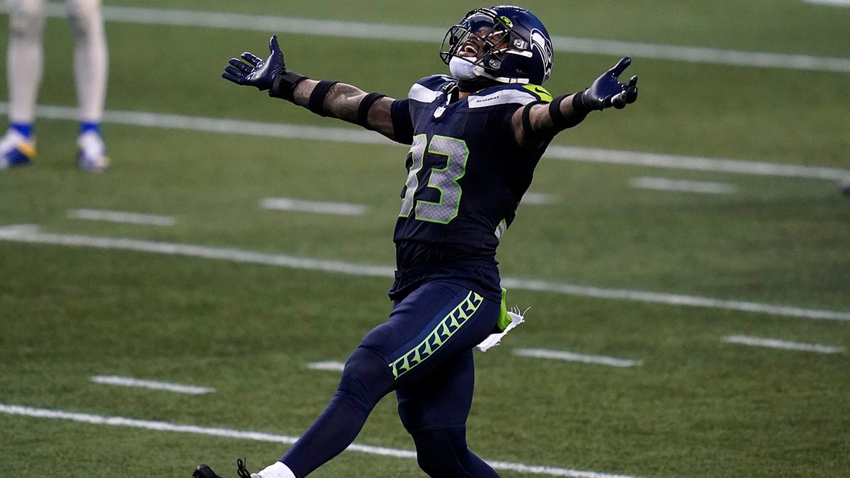 Seattle Seahawks strong safety Jamal Adams (33) reacts to a play against the Los Angeles Rams during the second half of an NFL football game, Sunday, Dec. 27, 2020, in Seattle. The Seahawks won 20-9. (AP Photo/Elaine Thompson)