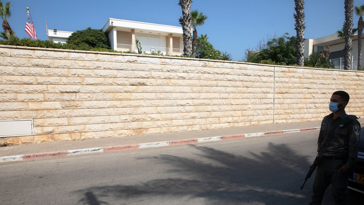 In this September 2020 file photo, an Israeli border police officer stands guard next to the U.S. ambassador's official residence in a suburb of Tel Aviv. An official record shows that the United States sold the ambassador’s residence in Israel for more than $67 million in July. (AP Photo/Sebastian Scheiner, File)