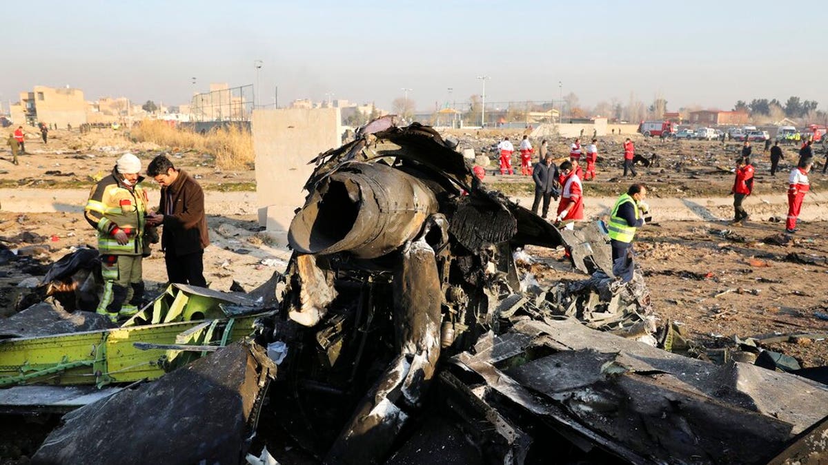 FILE: Debris litters the scene where a Ukrainian plane crashed in Shahedshahr southwest of the capital Tehran, Iran. 