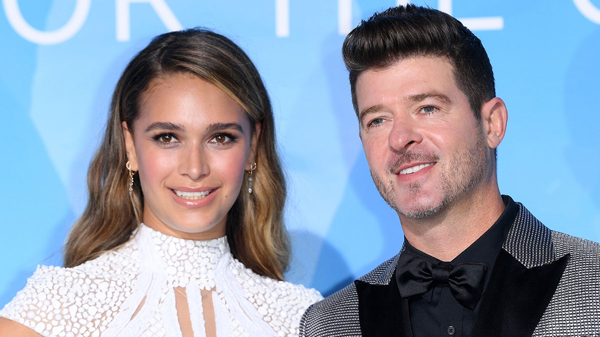 April Love Geary and Robin Thicke are expecting their third child together. They already share two daughters: 2-year-old Mia Love and 1-year-old Lola Alain. (Photo by Daniele Venturelli/Daniele Venturelli/ Getty Images Getty Images for Fondation Prince Albert II)