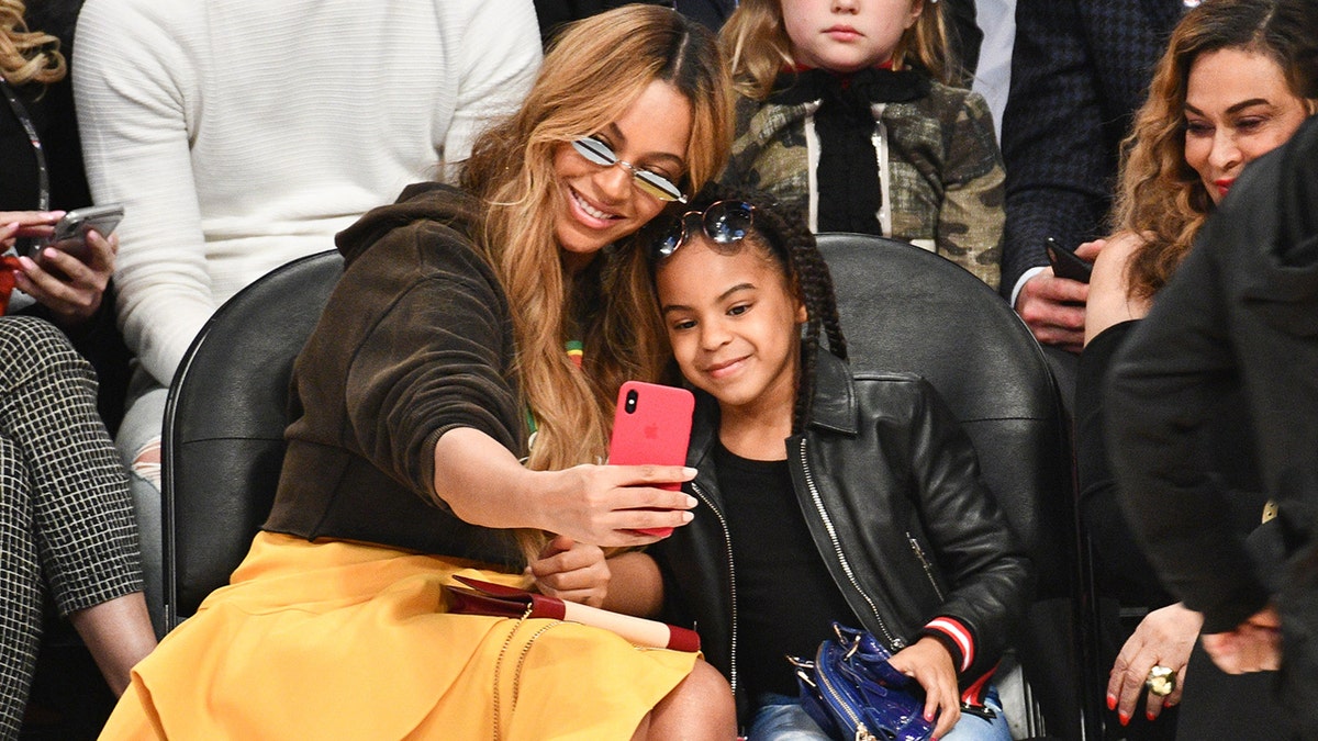 Beyonce and Blue Ivy Carter attend the NBA All-Star game