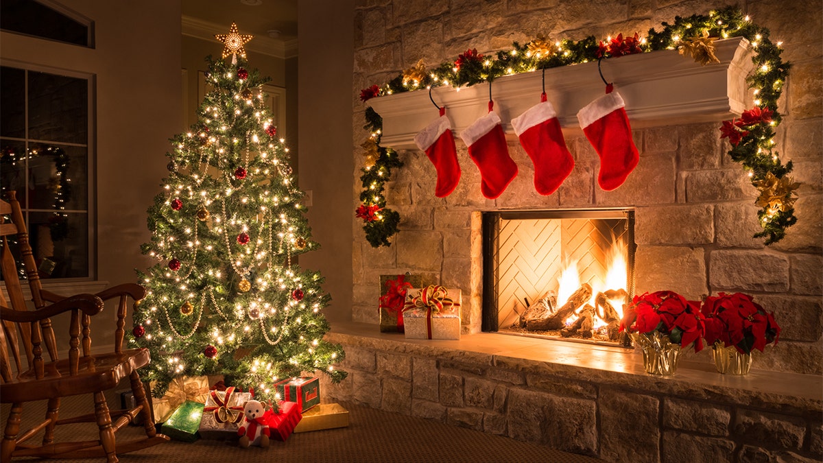 Christmas tree, gifts and an open fire