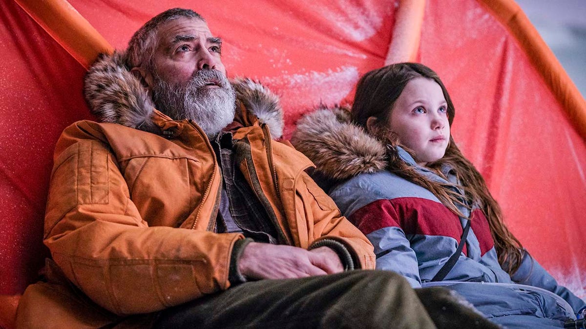 George Clooney (left) and Caoilinn Springall (right) in Netflix's 'The Midnight Sky.'