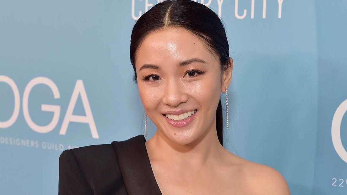 Constance Wu smiles for a photo
