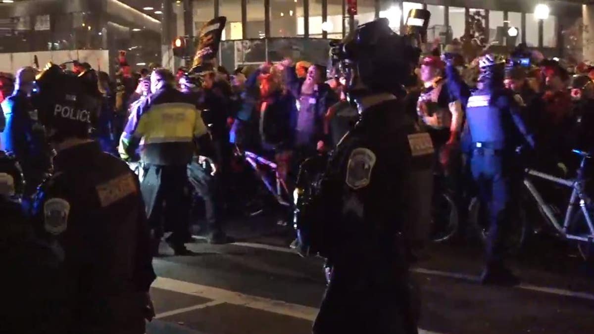 A heavy police presence was seen after nightfall in Washington D.C. as Trump supporters and far-left demonstrators flooded the streets on Saturday, Dec. 12. 