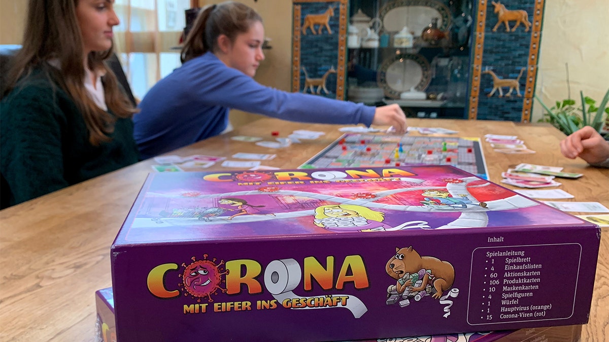 Rebecca, Lara, Stella and Sarah Schwaderlapp, from Wiesbaden, Germany, created the board game "Corona" during the country's first lockdown earlier this year.