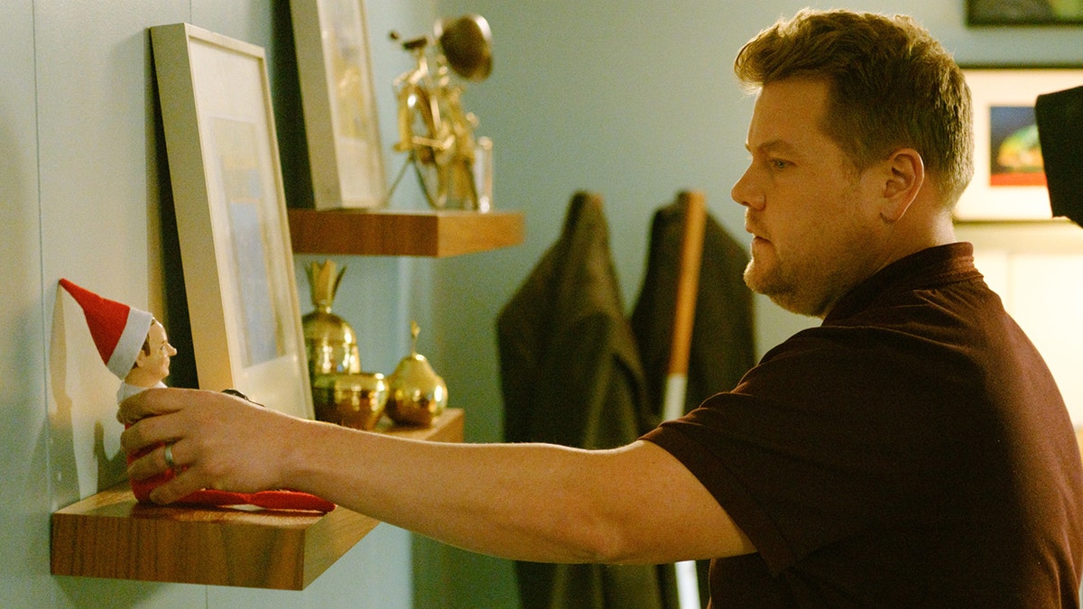 For a sketch, James Corden participated in the Elf on the Shelf tradition in 2017. (Photo by Terence Patrick/CBS via Getty Images)