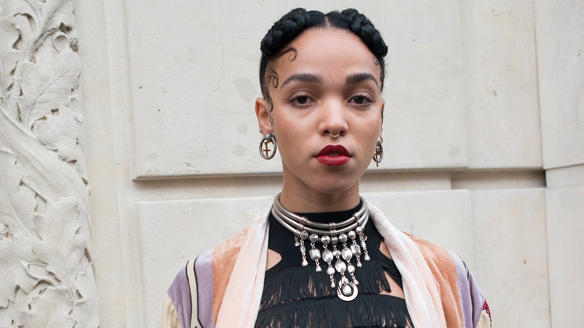 Singer FKA Twigs recounted a trip she took with LaBeouf where he allegedly threw her against a car and threatened to crash if she said she didn't love him. (Photo by Kirstin Sinclair/Getty Images)