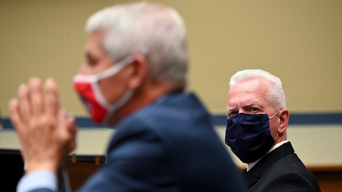 WASHINGTON, DC - JULY 31: Admiral Brett Giroir, U.S. assistant secretary for health (R), and Anthony Fauci, director of the National Institute of Allergy and Infectious Diseases. (Photo by Erin Scott-Pool/Getty Images)