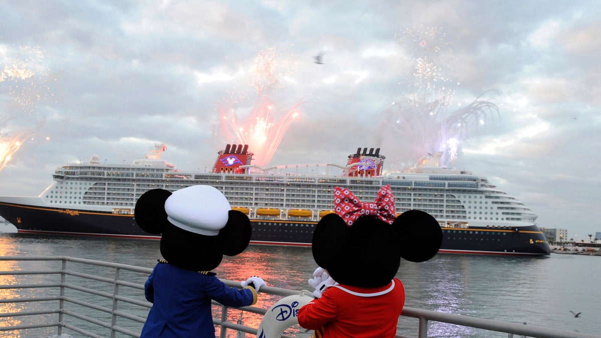 Mickey Mouse and Minnie Mouse look on as the Disney Dream sails into her home port of Port Canaveral, Fla.