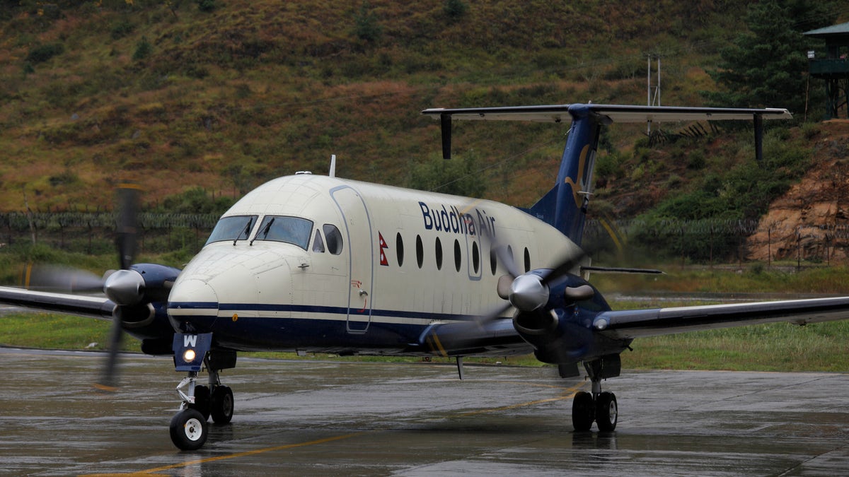 A Buddha Air Beechcraft 1900D aircraft taxis on the tarmac in Bhutan. On Dec. 18, a group of Buddha Air passengers probably weren’t too happy to exit their domestic flight in Nepal – at the wrong airport. (Ed Jones/AFP via Getty Images)