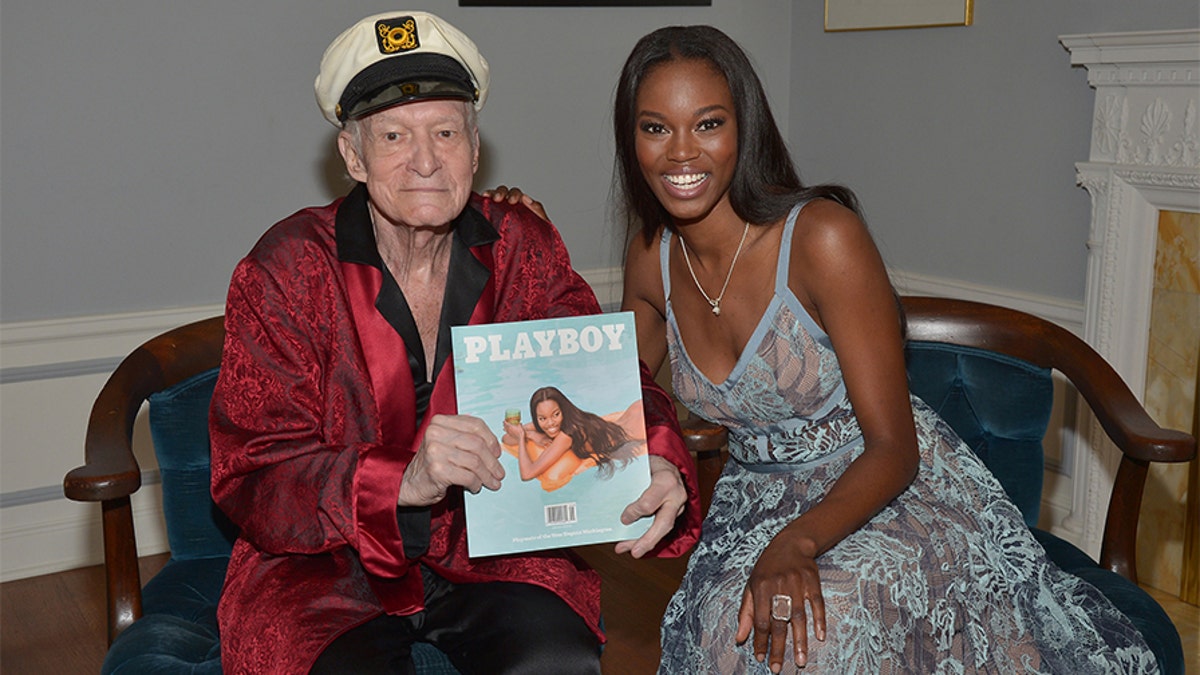 Playboy founder and Editor-in-Chief Hugh Hefner with 2016 Playmate of the Year Eugena Washington. Hefner passed away in 2017 at age 91.