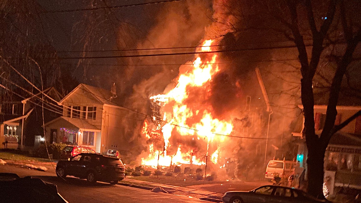 The Mojica's home in Metuchen, N.J. engulfed in flames. 