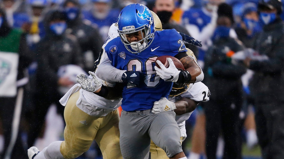 Buffalo running back Jaret Patterson (26) carries the ball during the first half of an NCAA college football game against Akron in Amherst, N.Y., Saturday, Dec. 12, 2020. (AP Photo/Jeffrey T. Barnes)