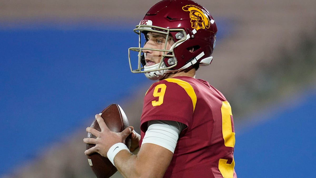 Southern California quarterback Kedon Slovis (9) looks for a receiver during the first quarter of an NCAA college football game against UCLA, Saturday, Dec. 12, 2020, in Pasadena, Calif. (AP Photo/Ashley Landis)