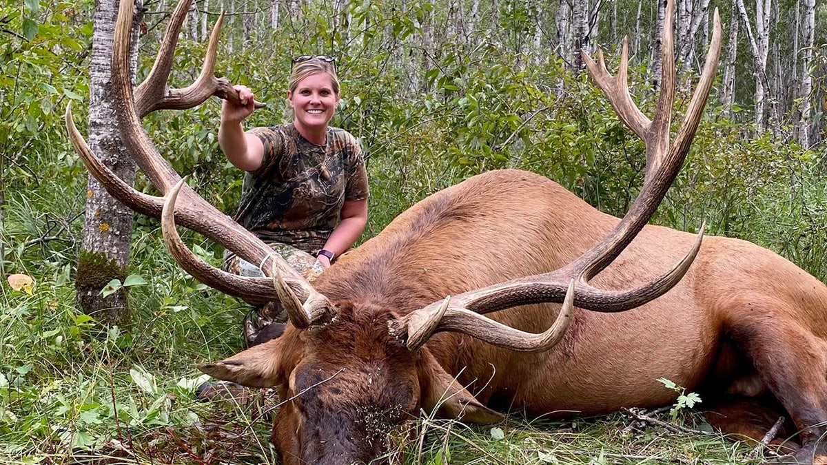 Lacey Lupien poses with her giant bull elk, harvested Aug. 6.