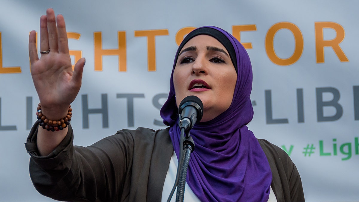 Linda Sarsour speaking at a mic