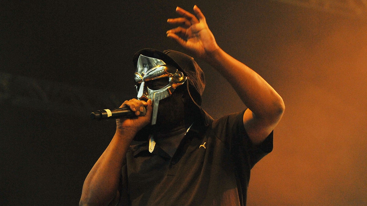 Rapper and forme KMD member MF DOOM was known for performing in a silver mask. (Photo by Jim Dyson/Redferns)