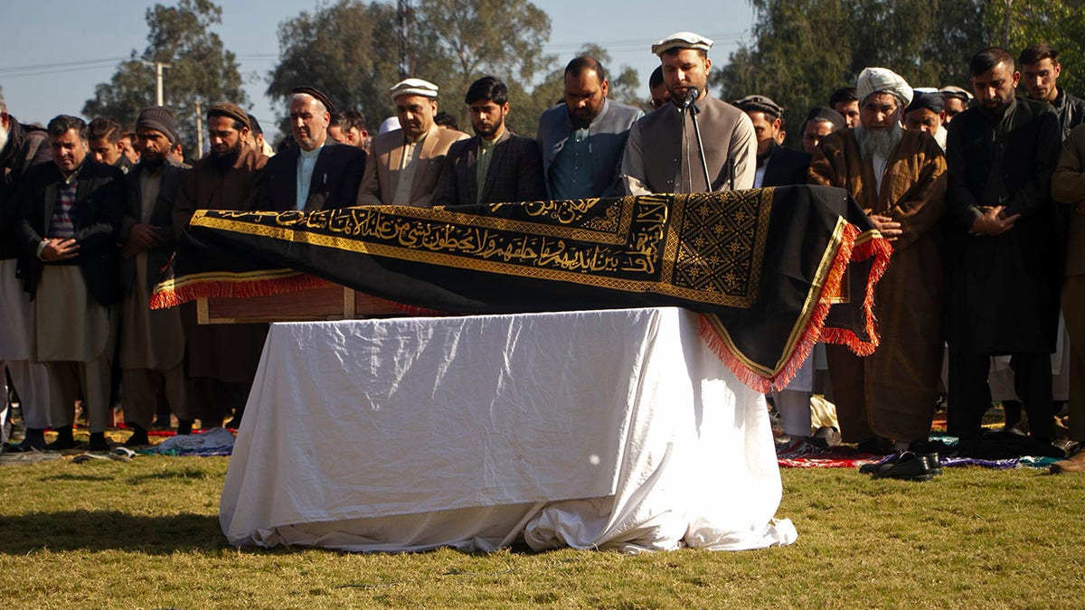 Afghans pray for TV anchor Malala Maiwand who was shot and killed by gunmen soon after she left her house early Thursday, during her funeral ceremony in Jalalabad, east of Kabul, Afghanistan, Thursday, Dec. 10, 2020. (AP Photo)