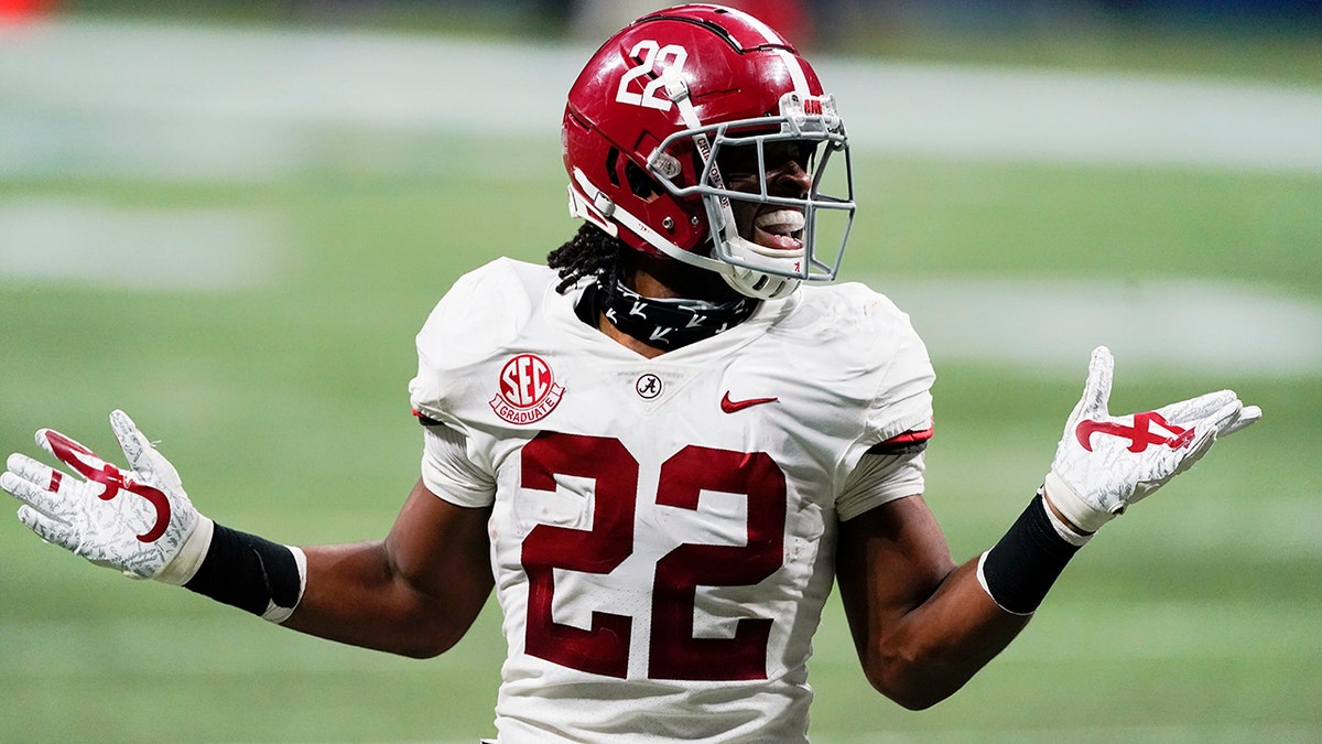 Alabama running back Najee Harris (22) reacts to his touchdown against Florida during the first half of the Southeastern Conference championship NCAA college football game, Saturday, Dec. 19, 2020, in Atlanta. (AP Photo/John Bazemore)