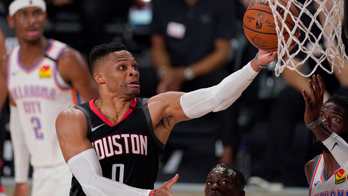 In this Wednesday, Sept. 2, 2020 file photo, the Houston Rockets' Russell Westbrook (0) goes up for a shot as the Oklahoma City Thunder's Nerlens Noel, right, defends during the second half of an NBA first-round playoff basketball game in Lake Buena Vista, Fla. (AP Photo/Mark J. Terrill, File)