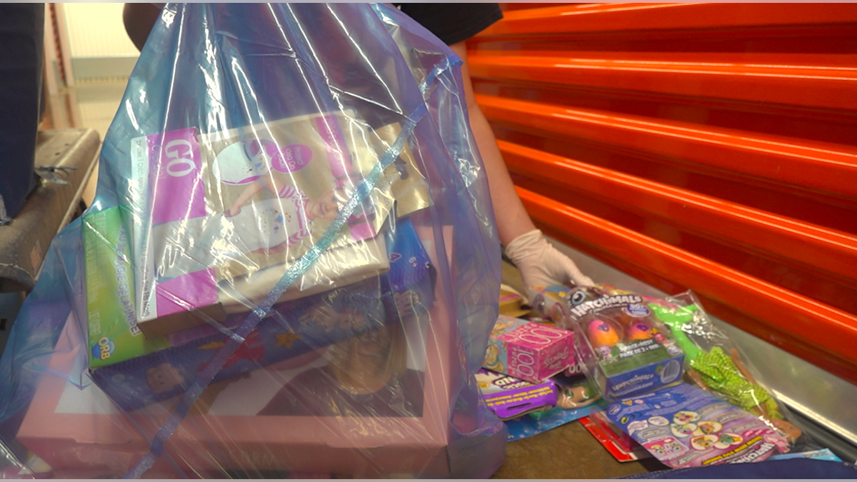 Volunteer packaging toys for children this holiday season. Source: Fox News